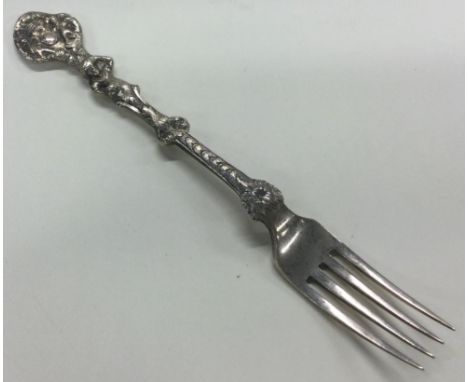 A Victorian silver figural fork with embossed decoration. London 1852. Approx. 59 grams. Est. £50 - £80.