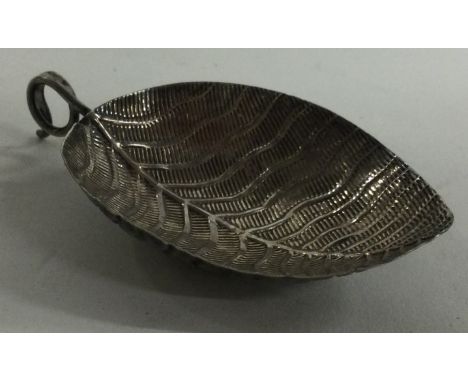 A George III silver caddy spoon with leaf shaped bowl. Birmingham 1800. Approx. 5 grams. Est. £100 - £150.