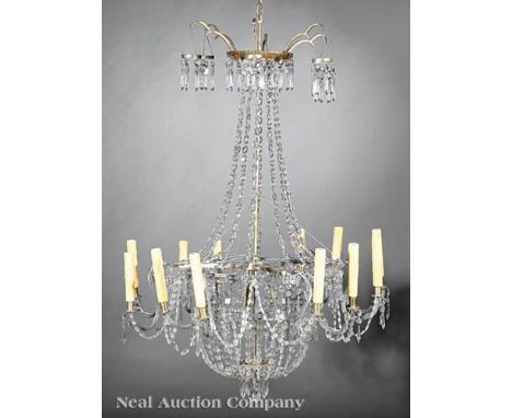 Neoclassical-Style Brass and Crystal Twelve-Light Chandelier, prism-hung corona, oval button chains, ring with scrolled arms 