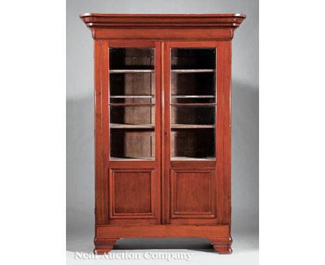 American Classical Walnut Bookcase, mid-19th c., stepped ogee molded cornice, pair of paneled glazed doors, original shelf in