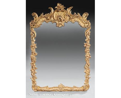 Antique Louis XV-Style Giltwood Mirror, 19th c., rocaille and shell carved crest, floral vine and branchwork surround, h. 72 