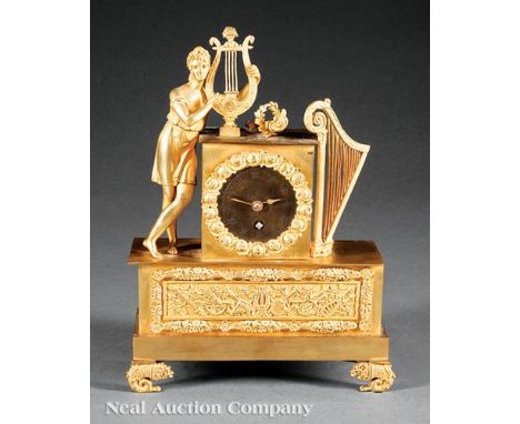 Diminutive Empire Gilt Bronze Figural Clock, early 19th c., depicting Apollo playing his lyre, with other attributes, musical