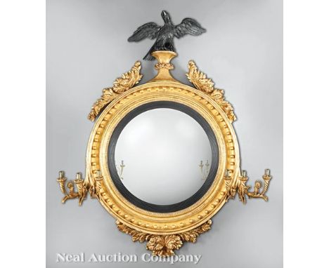 Fine and Rare Regency Girandole Mirror of Monumental Scale, c. 1810, surmounted by an ebonized spread-wing eagle flanked by a