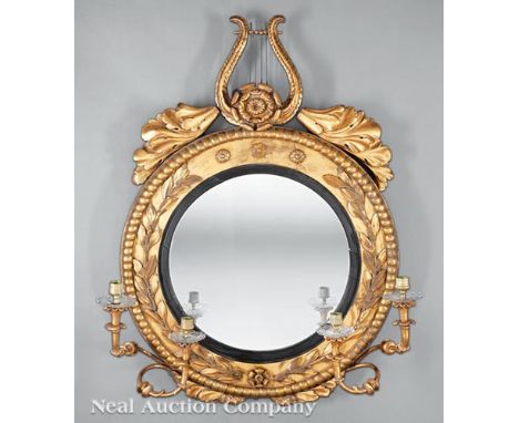 American or English Carved Giltwood Four-Light Girandole Mirror, early 19th c. and later, laurel leaf-carved frame surmounted