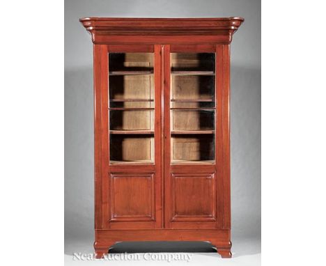 American Classical Walnut Bookcase, c. 1840-1850, ogee cornice, paneled glazed doors, original shelf interior, ogee bracket f