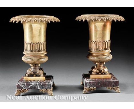 Pair of Charles X-Style Gilt Bronze and Marble Garniture Urns, 19th c., floral rim, cylindrical body, square base, bracket fe