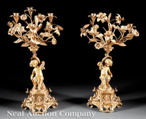Pair of Beaux Arts Gilt Bronze Figural Five-Light Candelabra, c. 1890, foliate arms, cherub standards, scrolled base, h. 21 i