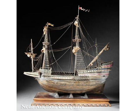 Handmade Wooden Model of a Galleon, 20th c., wood staves, cloth, rope, string and paint, on display base, total h. 44 1/2 in.