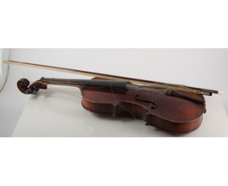 A violin and bow, labelled Stradivarius, one piece back.