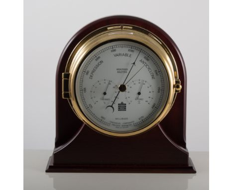 A ship's modern wall-mounted brass cased barometer by Weather Master, on a mahogany plinth, 23.5cm.