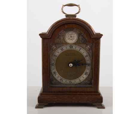 Elliott mahogany cased mantle clock, arch brass dial applied with cast figural spandrels, height 18cm.