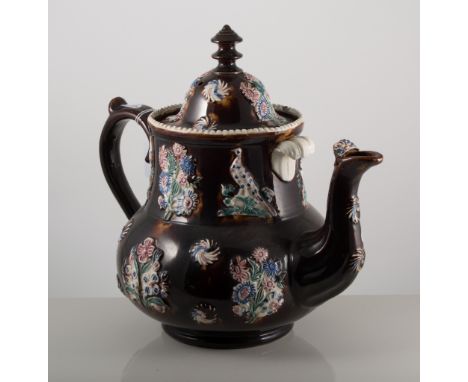 Bargeware treacle-glazed teapot, spriggs depicting pheasants, dated 1887, 34cm tall.