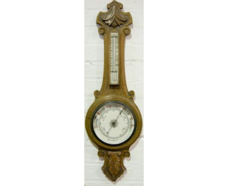 Carved cased aneroid barometer and thermometer, 90cm.