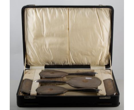 Silver mounted five-piece dressing table set, engine turned, in a fitted case, the case 39cm.