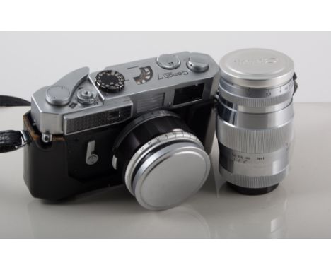 Cannon 7 SLR Camera with case, with a selection of Canon and other makers lenses, including Canon 85mm F1.9 with caps, etc. 