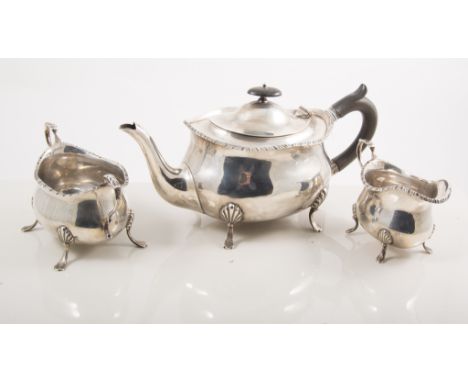 Silver three-piece teaset, William Hudson & Sons, Sheffield, 1918, serpentine gadrooned outlines, each piece raised four paw 