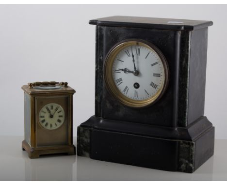 Two clocks: including a slate mantle clock and a brass cased carriage clock. (Catalogue amendment, there is now no domed case