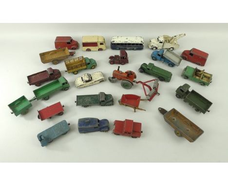 A quantity of Dinky toys including a 283 BOAC Bus, two red Trojans, an electric Dairy van, 420 Lorry, a Dodge truck, a Land R