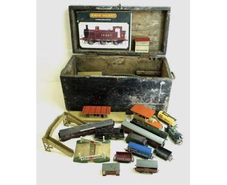 A wooden chest containing Hornby Meccano Ltd. trains and accessories including the Duchess of Montrose engine with tender, Gr