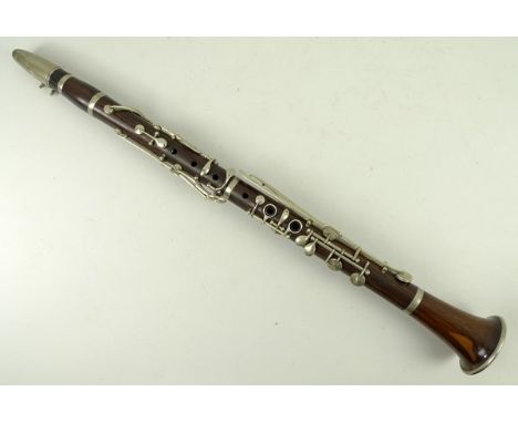 A French rosewood clarinet, stamped E. Duigou, with case. 