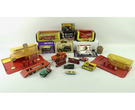 A quantity of Matchbox toys, including two garages, with cast metal Esso signs and petrol pumps, a Scammell tractor and trail