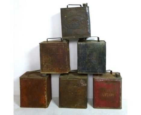 A collection of oil cans to include two Shell, one Esso, and one BP, and a military water can. (6)