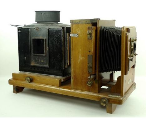 A Victorian magic lantern, converted to electricity, by J T Chapman Ltd, Manchester, 62 by 26 by 44cm. 