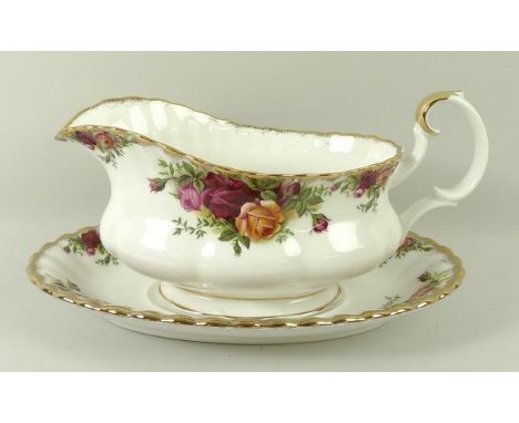 A Royal Albert porcelain part dinner and tea service decorated in the 'Old Country Roses' pattern, comprising a sauce boat an