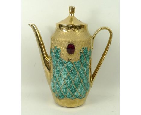 A Hutschenreuther porcelain coffee service, Vohenstrauss, Johann Seltmann, in gold and viridian green, with inset faceted red