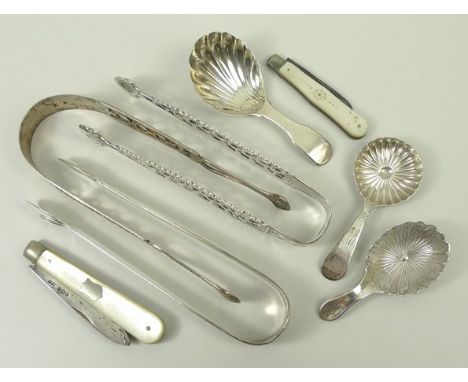 A pair of George III silver sugar tongs, monogram engraved, George Nangle, London 1800, two pairs of pierced and bright cut s