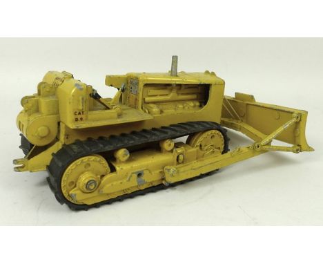 A Triang Spot On die cast 1/42 scale Caterpillar D9, with black rubber tracks, 16cm long, unboxed.