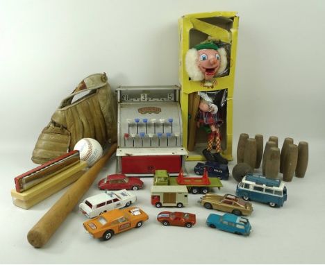 A Pelham Puppets SM4 MacBoozle in original box, a Codeg toy till, a set of treen skittles, The Bandmaster harmonica with case