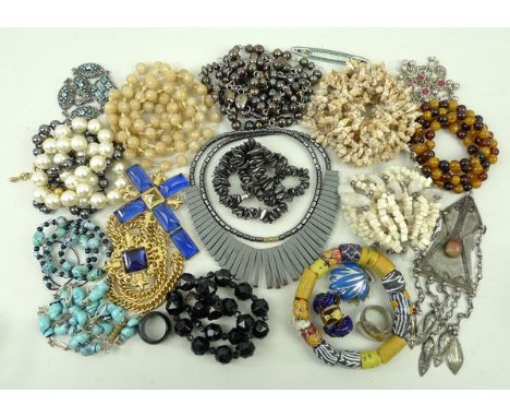 A quantity of vintage and costume jewellery including a silver necklace, a cameo, various hematite necklaces and two carved g