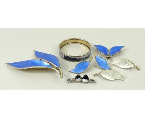An Aksel Holmsen silver and guilloche enamel baby's bangle, David Andersen silver gilt and blue enamel double leaf brooch, sm