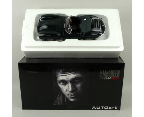 An Autoart Steve Mcqueen Racing model of a Jaguar XK55, scale 1:18, mint and boxed.