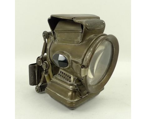 A Joe Lucas Co Ltd Silver King of the Road bicycle lamp, complete with paraffin wick and red and green reflector sides. 