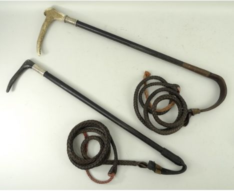 A leather hunting lunge whip with horn handle and silver ferule, London 1999, and another with stag antler handle and silver 