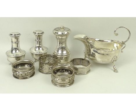 A Victorian silver sauce boat raised on hoof feet, George Nathan & Risdley Hayes, Chester 1900, pair of pepperettes, Birmingh