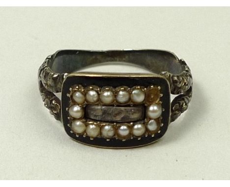 A Regency silver hair locket mourning ring set with black enamel and a surround of seed pearls, engraved 'Sarah Legg, Ob 22 O