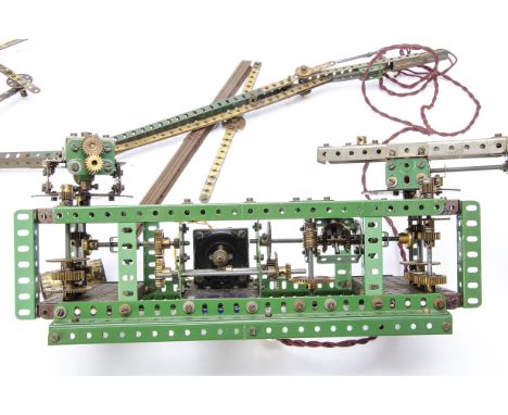 An electronic  Meccano construction believed to be for a Fairground ride and other items, Meccano frame 18'' long, 7'' wide a
