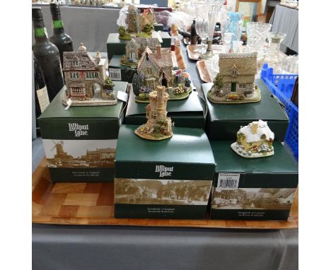 Four trays containing boxed Lilliput lane buildings to include: 'High Spirits', 'The Sand Castle', 'Winter Warmer', 'Hollande