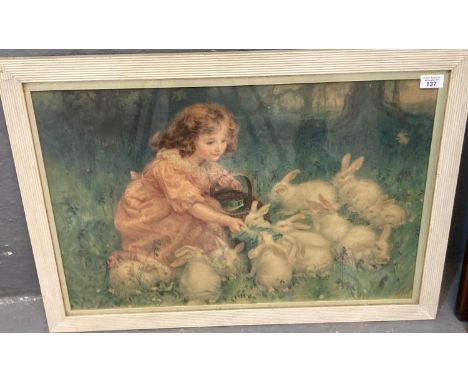 Children's nursery picture of a little girl feeding white rabbits, coloured print.  49x70cm approx.  Framed and glazed.  (B.P