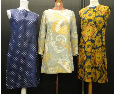 Three vintage 1960's shift dresses: two sleeveless; one polka dot print by St Michael's and the other a psychedelic print and