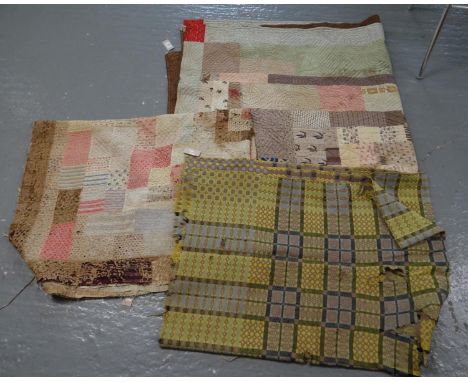 Two vintage cotton patchwork quilts; one Welsh quilt with sewn in leaf and spiral designs. Together with a vintage woollen We