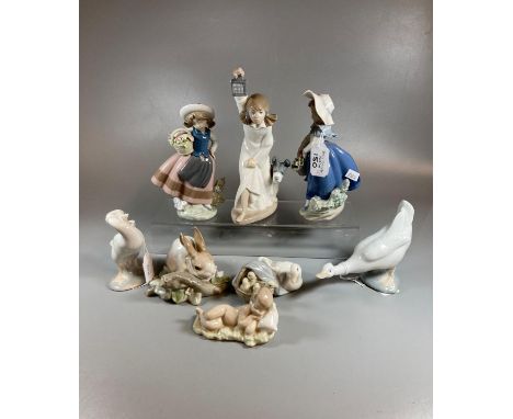 Group of seven Spanish porcelain Nao and Lladro figurines of children and animals to include: sleeping baby, rabbit, geese et