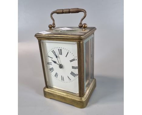 French Brass carriage clock with full depth enamel Roman face. 12cm high approx. (B.P. 21% + VAT)  Tarnished - minor blemishe