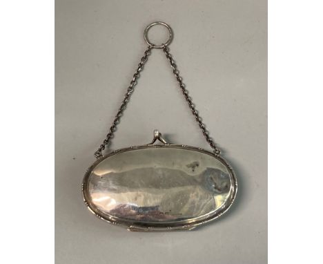 Edwardian design silver oval shaped ladies purse with chain and ring holder.  Rubbed hallmarks.  (B.P. 21% + VAT) 