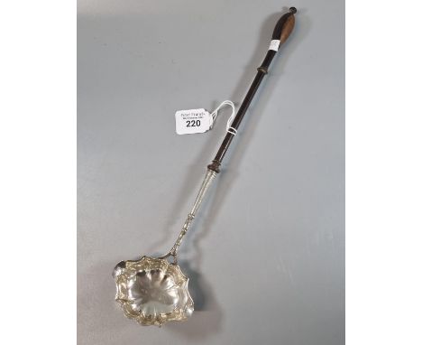 18th/19th century silver brandy ladle with rubbed hallmarks and turned wooden handle. (B.P. 21% + VAT)  No obvious damage, as
