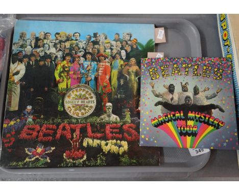 The Beatles 'Sgt. Peppers Lonely Hearts Club Band' vinyl record (PMC 7027), first pressing with red and white inner sleeve an