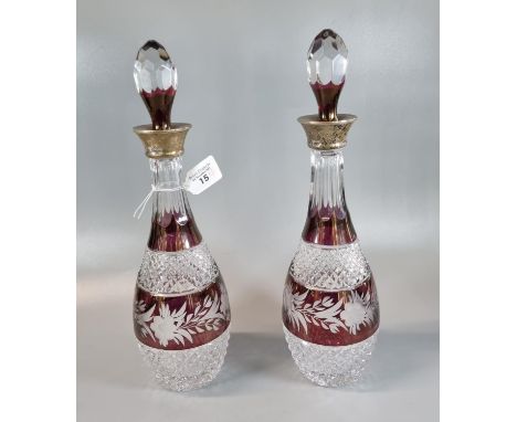 Pair of hobnail cut lead crystal flash cut ruby ground foliate silver collared decanters with stoppers. (2) (B.P. 21% + VAT) 